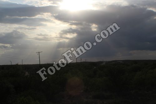 Sun Shining Through Clouds - FotoFino.com